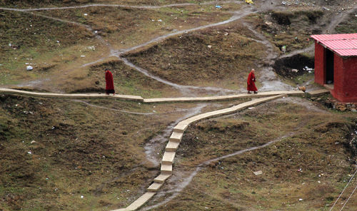 High angle view of monks walking on footpath