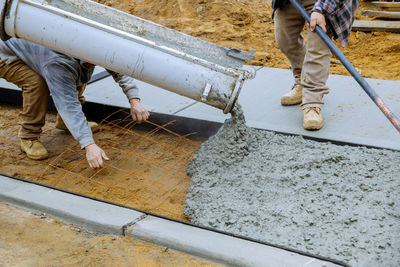 Low section of man working at construction site