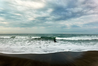 Scenic view of beach against sky