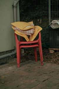 Empty chairs and table in abandoned building