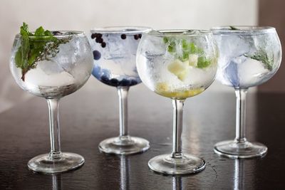 Close-up of wine glasses on table