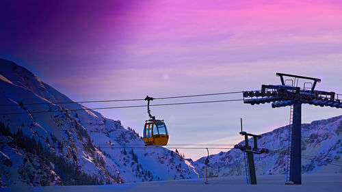 Overhead cable car against sky during winter