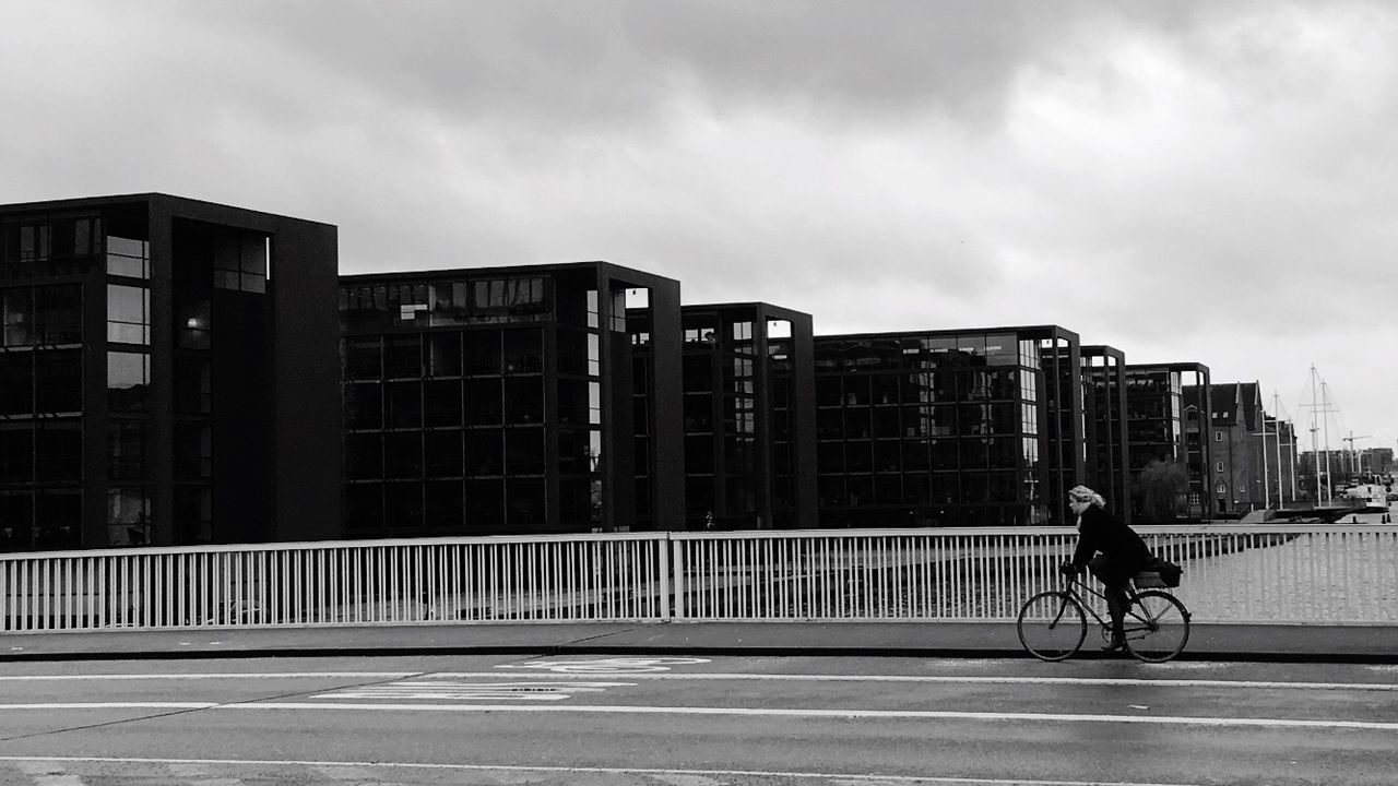 MAN ON BICYCLE IN CITY