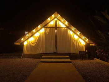 Camping tent against sky at night