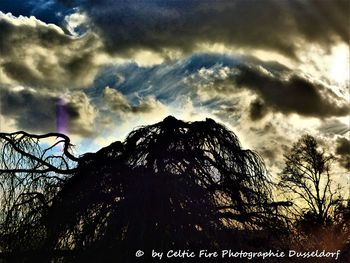 Low angle view of sun shining over mountain
