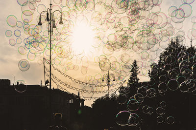 Low angle view of bubbles against sky