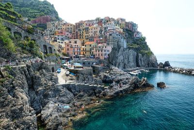 Panoramic view of sea and buildings against sky