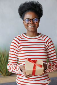 Portrait of young woman using mobile phone