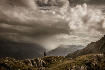 Hiker on the platé desert. facing mont blanc, the platé desert is mainly composed of lapiaz.