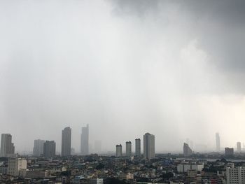 Modern buildings in city against sky