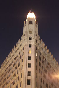 Low angle view of modern office building against sky