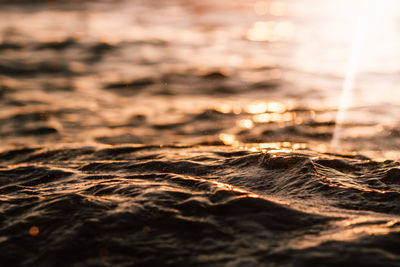 Close-up of sea at sunset