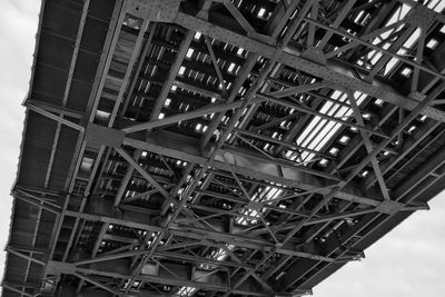 Low angle view of metal structure against sky