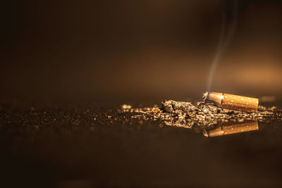 Close-up of cigarette against black background
