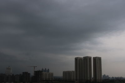 Modern buildings in city against sky