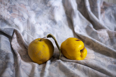 Close-up of yellow fruits on bed