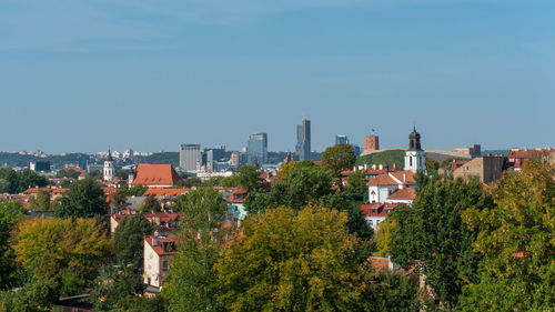 High angle view of trees and buildings against sky