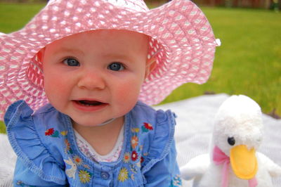 Portrait of cute baby boy with toy