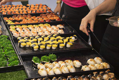 High angle view of man preparing food on barbecue grill