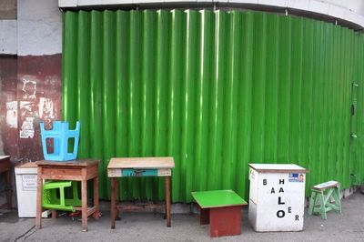 Empty chairs in front of built structure