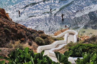 High angle view of buildings by sea