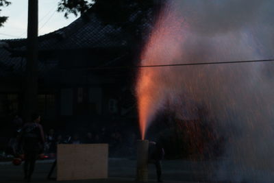 People standing by fire hydrant