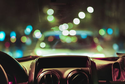 Defocused lights seen through car windshield