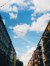 Low angle view of buildings in city against sky