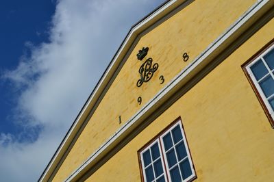 Low angle view of building against blue sky