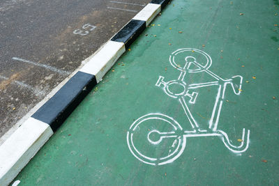 High angle view of bicycle sign on road