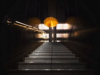 Man walking on footpath at night