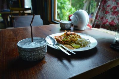 Close-up of food and drink on table in restaurant