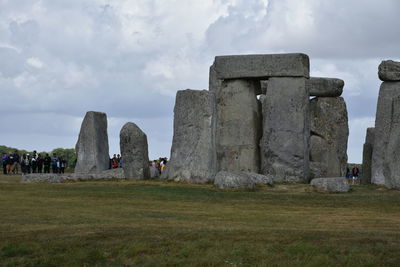 Built structure on field against sky