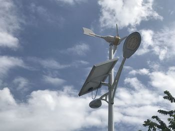 Low angle view of communications tower against sky