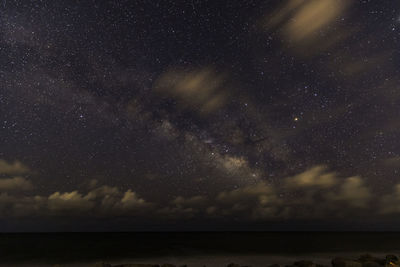 Scenic view of sea against sky at night