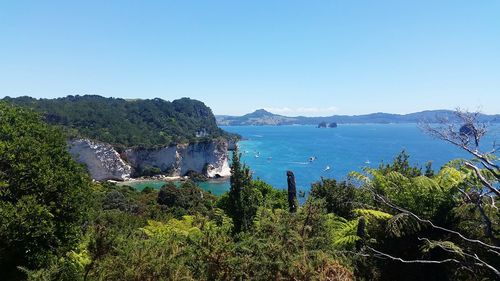 Scenic view of sea against clear blue sky