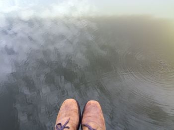 High angle view of person standing in water