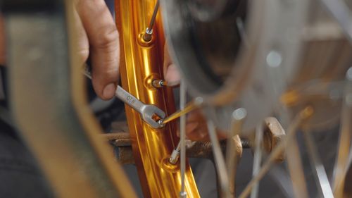 Close-up of hand holding chain