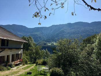 Scenic view of trees and buildings against sky
