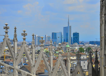 Modern buildings in city against sky