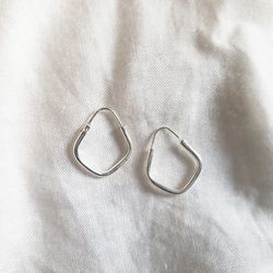 High angle view of eyeglasses on white fabric