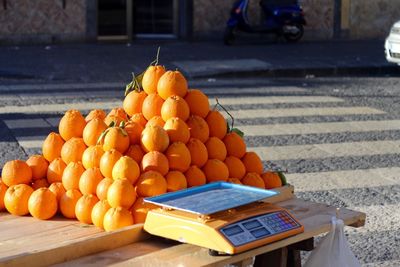 Stack of mandarin oranges for sale at street