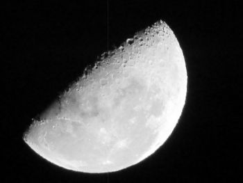 Low angle view of moon against sky at night