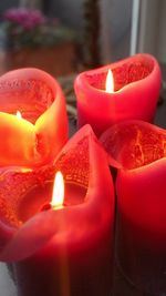 Close-up of illuminated tea light candles