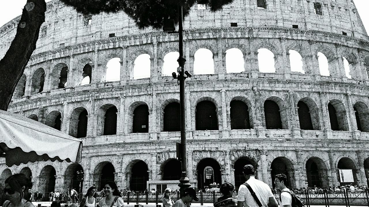 architecture, history, built structure, arch, tourism, famous place, travel destinations, international landmark, building exterior, travel, large group of people, tourist, ancient, coliseum, old ruin, culture, the past, ancient civilization, amphitheater