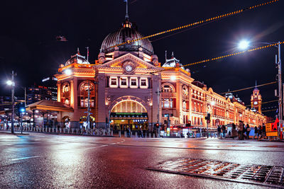 Illuminated buildings in city at night