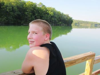 Portrait of young woman in lake