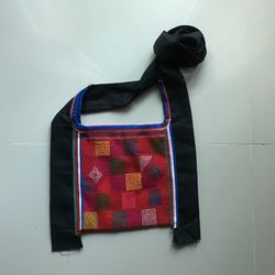 Close-up of shoes hanging against wall