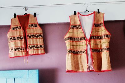 Low angle view of clothes hanging on wall