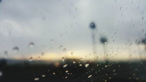 Full frame shot of wet glass window in rainy season